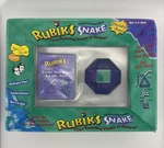 Nos Sealed Vintage 1997 Rubik's Snake Toy & Hints Booklet Purple Green. Fixed Price $45.00.