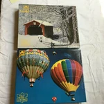 2 Sealed Golden Guild 500-550 Pc Puzzles Hutchins Bridge Hot Air Balloons. Fixed Price $24.99.