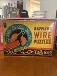 Baffling Wire Puzzles Lagoon Group Vintage New Box. Fixed Price $14.99.