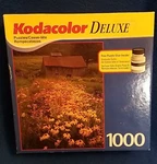 New: Kodacolor Deluxe 1000 Pc. Puzzle East Corinth, Vt. Black Eyed Susan Flowers. Fixed Price $14.98.