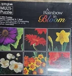 Springbok Puzzle Rainbow Bloom 6 Mini One Box Each 7X7 70 Pieces. Fixed Price $19.99.