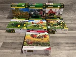 John Deere Puzzle Lot Of 7 / 1000 Case International Masterpieces. Fixed Price $42.99.