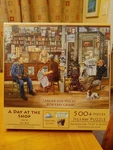 Sunsout Jigsaw Puzzle 500 Piece " Day At The Shop Les Ray. Fixed Price $15.99.