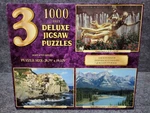 Sure-lox 3 1000 Piece Puzzles Golden Statue Manarola Italy Banff Alberta Canada. Fixed Price $39.97.