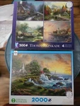 Ceaco Thomas Kinkade Four 500 Piece & One 1000 Jigsaw Puzzles. Fixed Price $30.00.