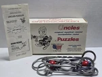 Vintage Uncles Puzzles Grand Wizard Iron Disentanglement Challenge Level Severe. Fixed Price $24.99.