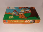 Vintage 1978 Milton Bradley Jim Davis Garfield Puzzle 60-PIECES Complete. Fixed Price $9.95.
