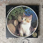 1976 Eaton Treasure Collection Round Puzzle Curiosity Cat Henry Thoreau Sealed. Fixed Price $50.00.