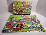 Vintage 1981 Milton Bradley Smurf Musical 100 Piece Puzzle Series 4190-2. Fixed Price $15.00.
