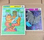 Vintage Golden Frame Tray Puzzles Garfield & Batman Returns. Fixed Price $21.85.