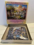 Main Street Along Country Village 1500 Piece Jigsaw Puzzle Sunsout. Fixed Price $28.50.
