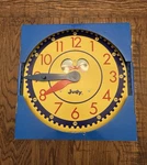 Carson Dellosa 13" X 12" Judy Clock, Learn To Tell Time Color Coded Handles. Fixed Price $15.00.