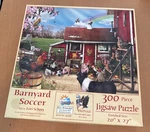 Sunsout 300 Piece Puzzle Called Barnyard Soccer. Fixed Price $24.00.