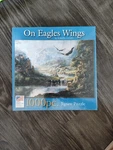 Great American Puzzle Factory 1000 Piece "on Eagles Wings". Fixed Price $15.99.