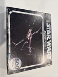 Vintage 1977 Sealed Star Wars 500 Piece Puzzle Space Battle, X-wing No. 40110. Fixed Price $49.95.