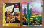 2 Springbok Jigsaw Puzzles Say Cheese 1,000 Pc Complete, Desert Glow Missing. Fixed Price $8.50.