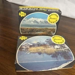 2 Tuco Round Mini Puzzles - Winters Stillness & Lofty Peaks 55+ Piece Complete. Fixed Price $16.00.