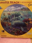 Sunsout 500 Piece 19.5" Round Puzzle By Corbert Gauthier Manatee Beach New. Fixed Price $24.95.