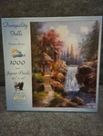 Sunsout 1000 Piece Puzzle Tranquility Falls By Dennis Lewan. Fixed Price $25.00.