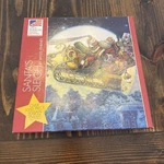 Great American Puzzle Co Santa Sleigh Myles Pinkey 1000 Pc Jigsaw. Fixed Price $12.95.