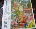 300 Piece Kathy Bambeck Art Puzzle "vintage Birdfeeder Garden" New 18" X 24". Fixed Price $13.95.