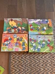 Set Of Vintage Smurf Milton Bradley Puzzles #4190-10, 4766-4, 4190-12, 4190-11. Fixed Price $45.00.